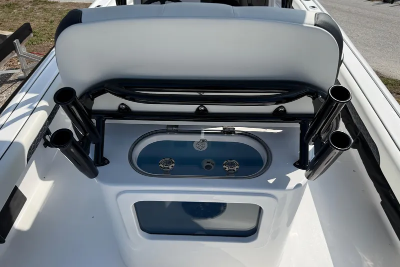 Slide: The Image of 2027 Tidewater 2500 Carolina Bay boat interior with rod holders and livewell. - 8