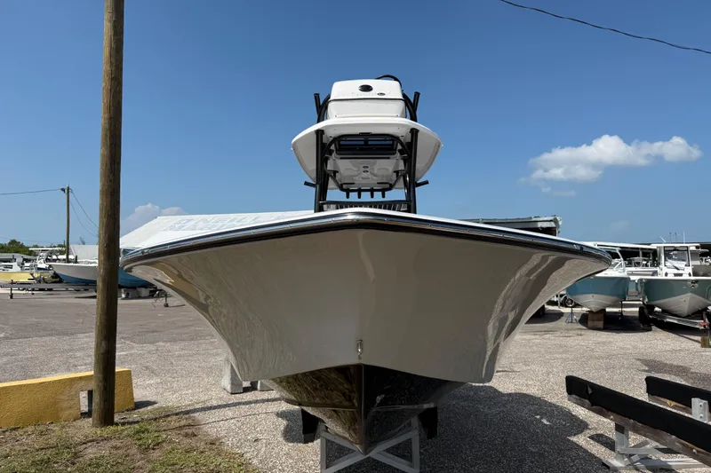 Slide: The Image of 2027 Tidewater 2500 Carolina Bay boat in a marina under clear blue sky. - 3