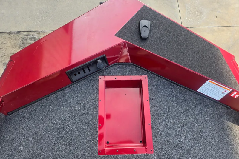 Slide: The Image of Red Lowe Stinger 175C boat deck, 2027 model, with carpeted surface and storage compartment. - 7