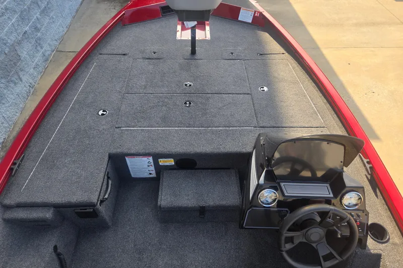 Slide: The Image of 2027 Lowe Stinger 175C boat interior with gray carpet and red trim. - 5