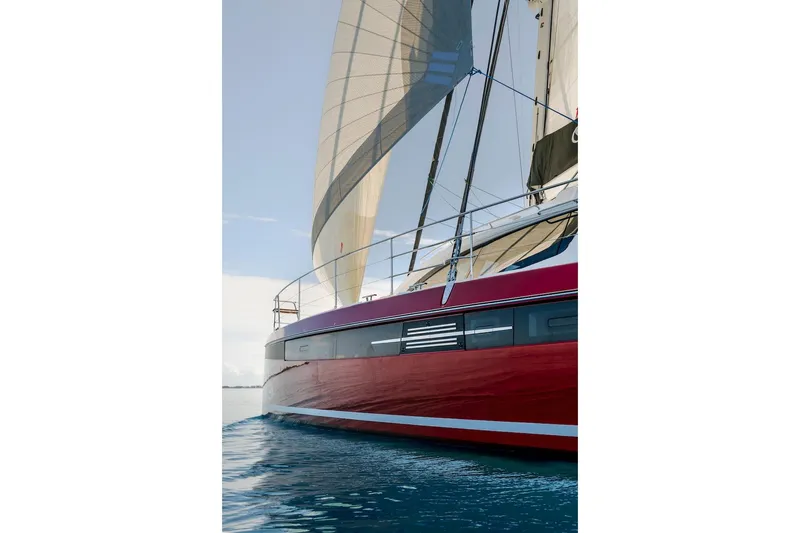Slide: The Image of Red Privilege Signature 510 sailboat, 2025 model, on calm water. - 62