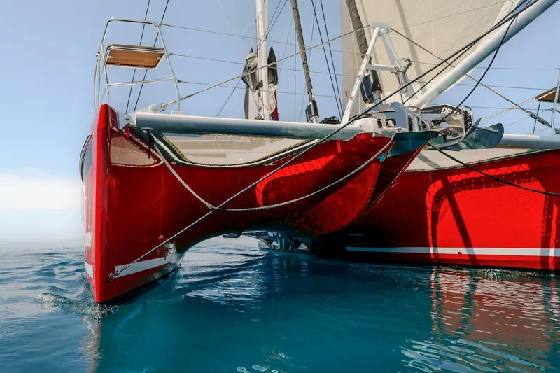 Slide: The Image of Red Privilege Signature 510 catamaran on calm water, year 2025. - 65