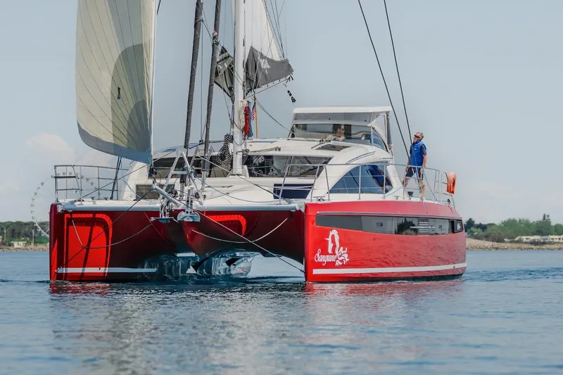 Slide: The Image of Red Privilege Signature 510 catamaran on calm water, year 2025. - 77