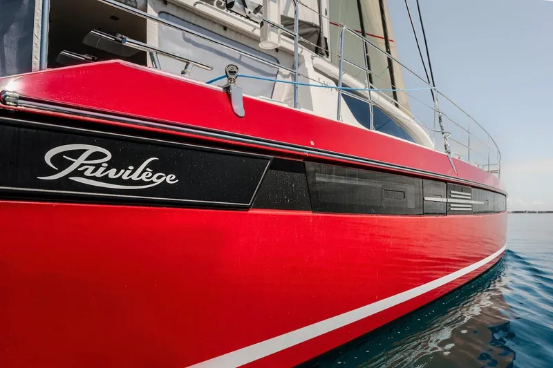 Slide: The Image of Red Privilege Signature 510 yacht from 2025 on calm water. - 4