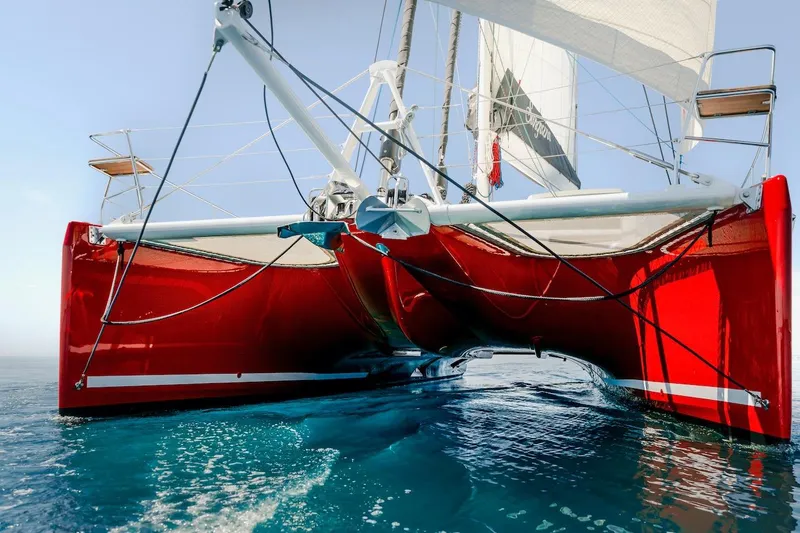 Slide: The Image of Red Privilege Signature 510 catamaran on calm water, year 2025. - 67