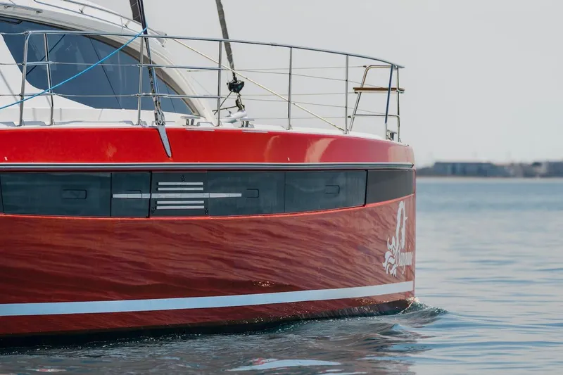 Slide: The Image of Red Privilege Signature 510 catamaran on calm water, year 2025. - 72