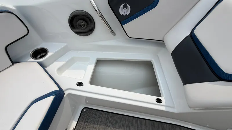 Slide: The Image of Interior view of a Scarab 195 ID boat with cushioned seats and a built-in speaker. - 48