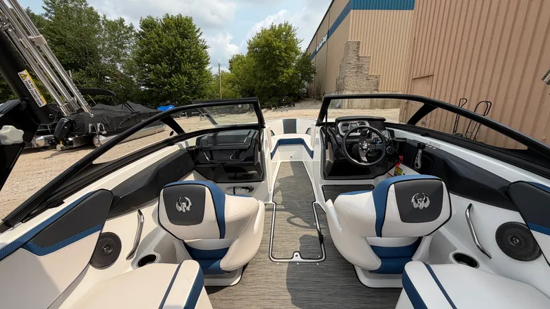 Slide: The Image of The image shows the interior of a 2023 Scarab 195 ID boat with modern seating and sleek design. - 26
