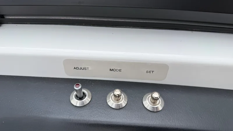 Slide: The Image of Three metal switches on a boat panel labeled "ADJUST," "MODE," and "SET." - 37