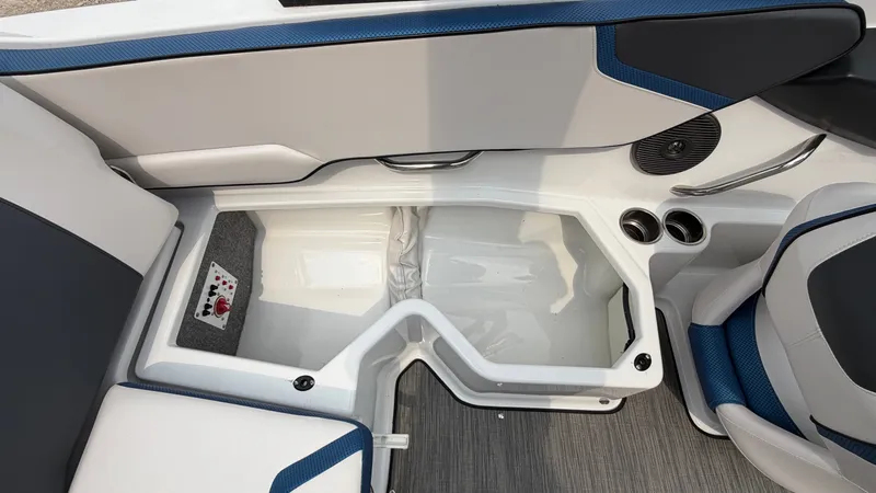 Slide: The Image of Interior of a 2023 Scarab 195 ID boat with blue and gray seating. - 21