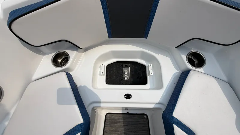 Slide: The Image of The image shows the bow area of a 2023 Scarab 195 ID boat with blue accents. - 46