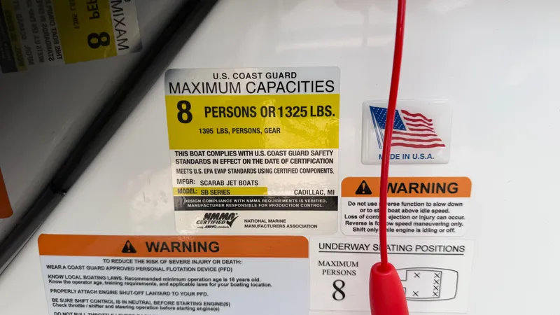 Slide: The Image of Safety label on a boat with capacity and warning information. - 38