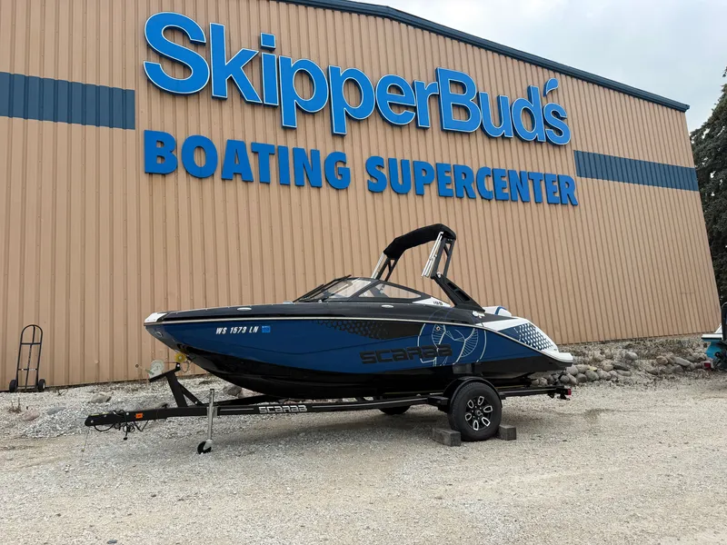 The Image of Scarab 195 ID 2023 in front of a boating supercenter. - 0