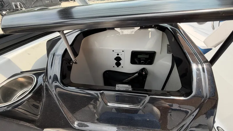 Slide: The Image of The image shows the dashboard of a Scarab 195 ID boat with controls and a radio. - 29
