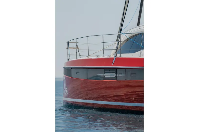 Slide: The Image of Red Privilege Signature 510 catamaran, 2025 model, on calm water. - 79