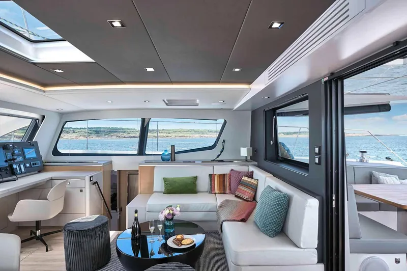 Slide: The Image of Luxurious interior of 2025 Privilege Signature 580 yacht with modern seating and ocean view. - 39