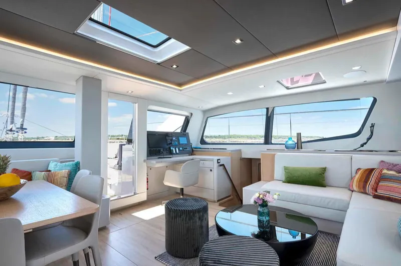 Slide: The Image of Luxurious interior of 2025 Privilege Signature 580 yacht with modern furnishings and panoramic windows. - 38