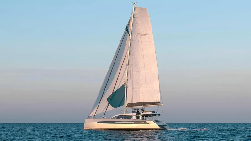 Slide: The Image of Luxury Privilege Signature 580 catamaran sailing on calm sea, 2025 model. - 5