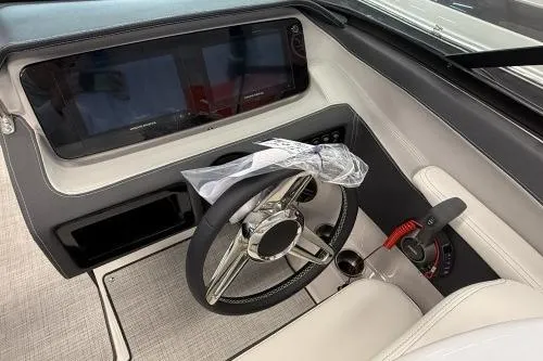 Slide: The Image of 2027 Regal LS4 boat dashboard with steering wheel and modern controls. - 5