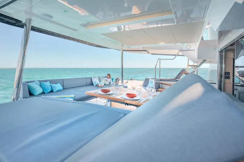 Slide: The Image of Luxurious 2025 Privilege Signature 650 yacht with elegant outdoor seating and ocean view. - 24