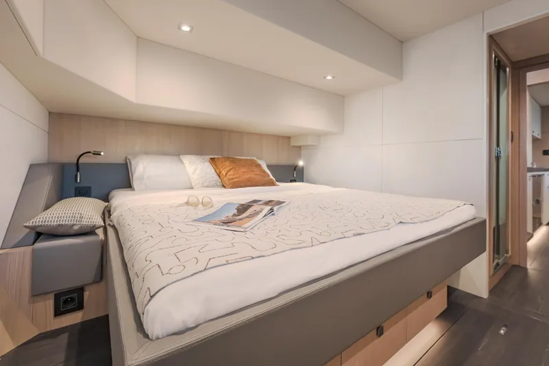 Slide: The Image of Luxurious bedroom interior of 2025 Privilege Signature 650 yacht, featuring modern design and cozy bedding. - 39