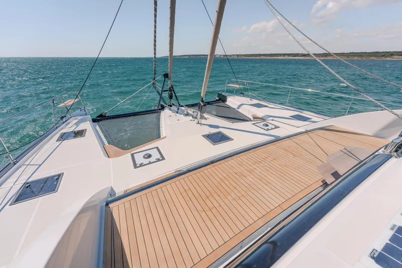 Slide: The Image of Luxury Privilege Signature 650 yacht deck, 2025 model, sailing on open sea. - 14