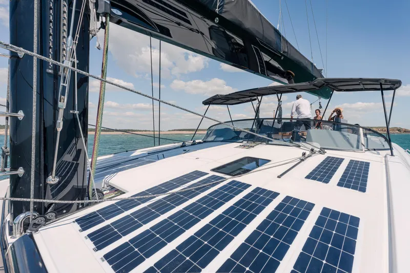 Slide: The Image of 2025 Privilege Signature 650 yacht with solar panels, sailing on a sunny day. - 11