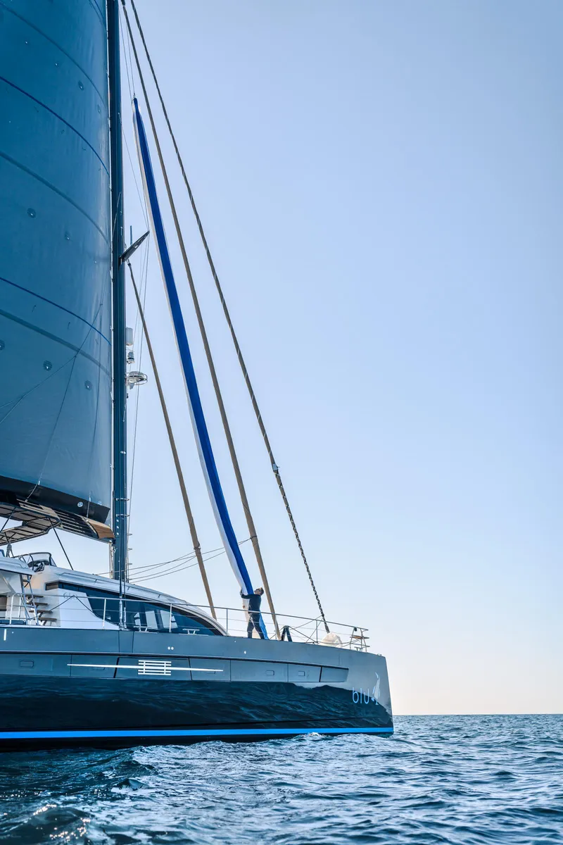 Slide: The Image of Luxury Privilege Signature 650 catamaran sailing on open sea, 2025 model. - 3