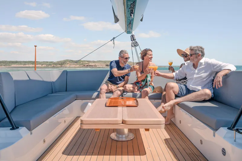Slide: The Image of People enjoying drinks on a 2025 Privilege Signature 650 yacht deck. - 12