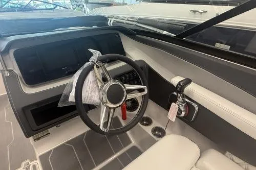 Slide: The Image of 2027 Regal LS2 boat interior with steering wheel and control panel. - 5