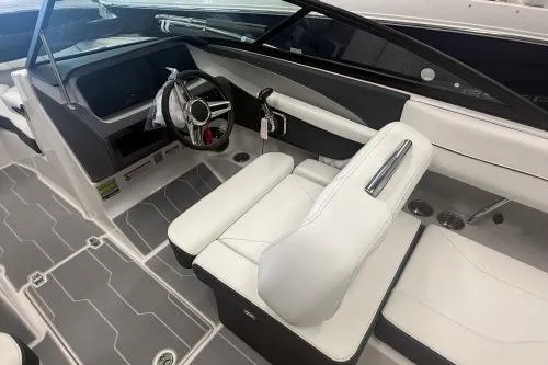 Slide: The Image of 2027 Regal LS2 boat interior with sleek white seating and modern dashboard design. - 4