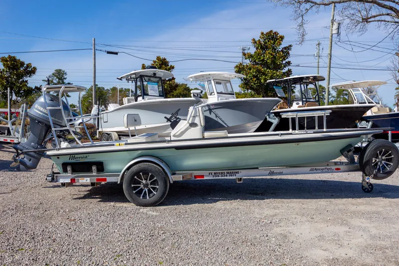 Slide: The Image of 2024 Maverick 17 HPX-S boat on trailer, displayed outdoors at a dealership. - 5