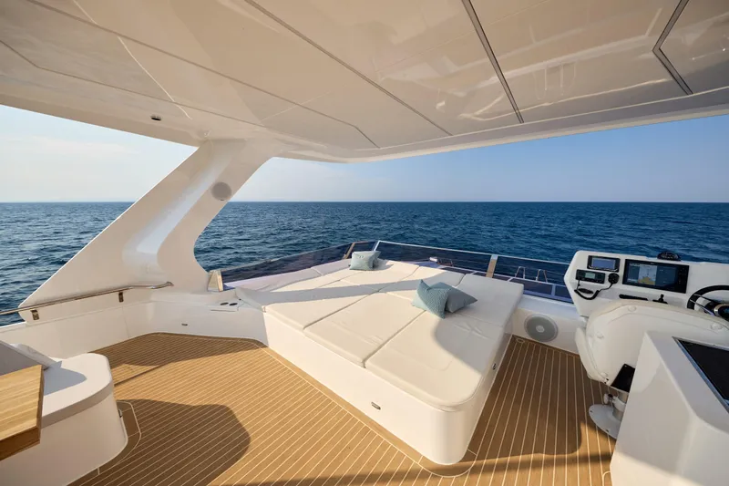 Slide: The Image of Luxurious 2025 Omaya 50 Power Catamaran deck with ocean view and modern seating. - 42