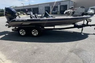 Slide: The Image of 2014 Skeeter ZX200 boat on trailer in sunny parking lot. - 9