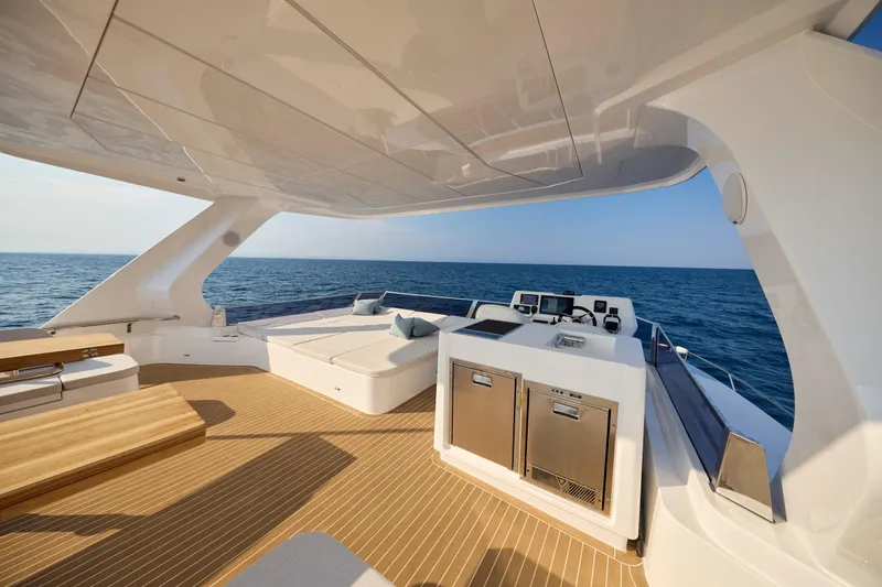 Slide: The Image of Luxurious 2025 Omaya 50 Power Catamaran with spacious deck and ocean view. - 40