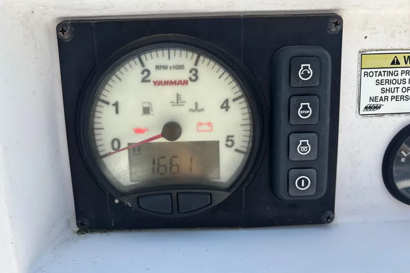 Slide: The Image of Yanmar RPM gauge on 2015 Catalina 275 Sport boat dashboard, showing 1661 hours. - 33