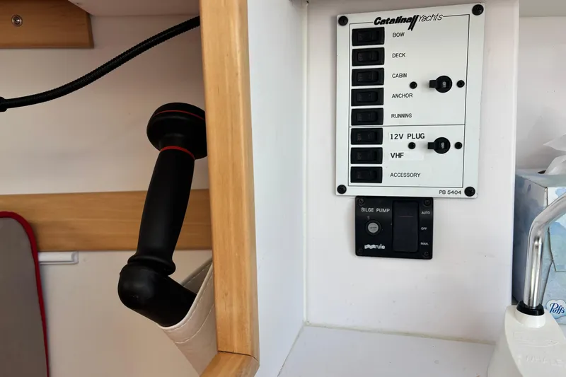Slide: The Image of Control panel of a 2015 Catalina 275 Sport yacht with switches and bilge pump. - 23
