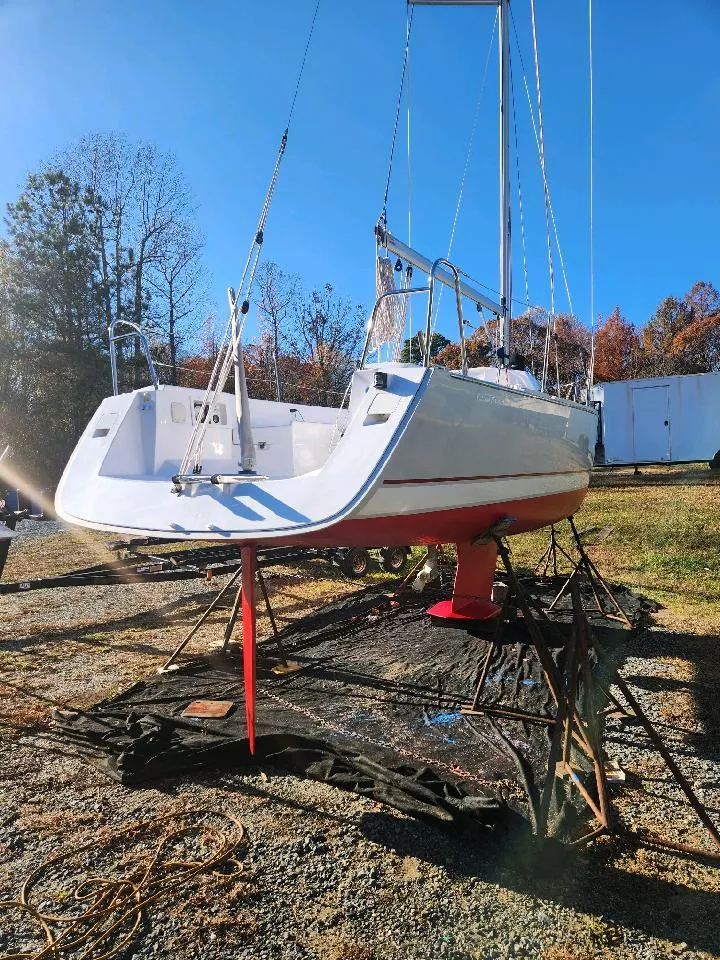 Slide: The Image of A 2015 Catalina 275 Sport sailboat is on a stand on land. - 9