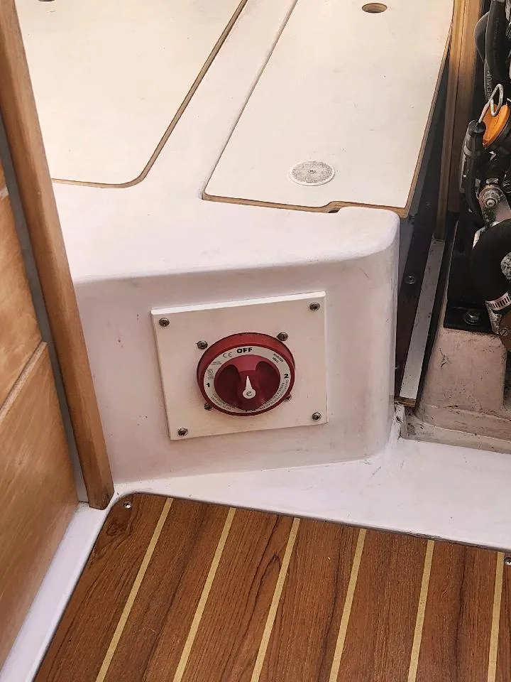 Slide: The Image of Close-up of a switch on a boat with wooden flooring. - 28