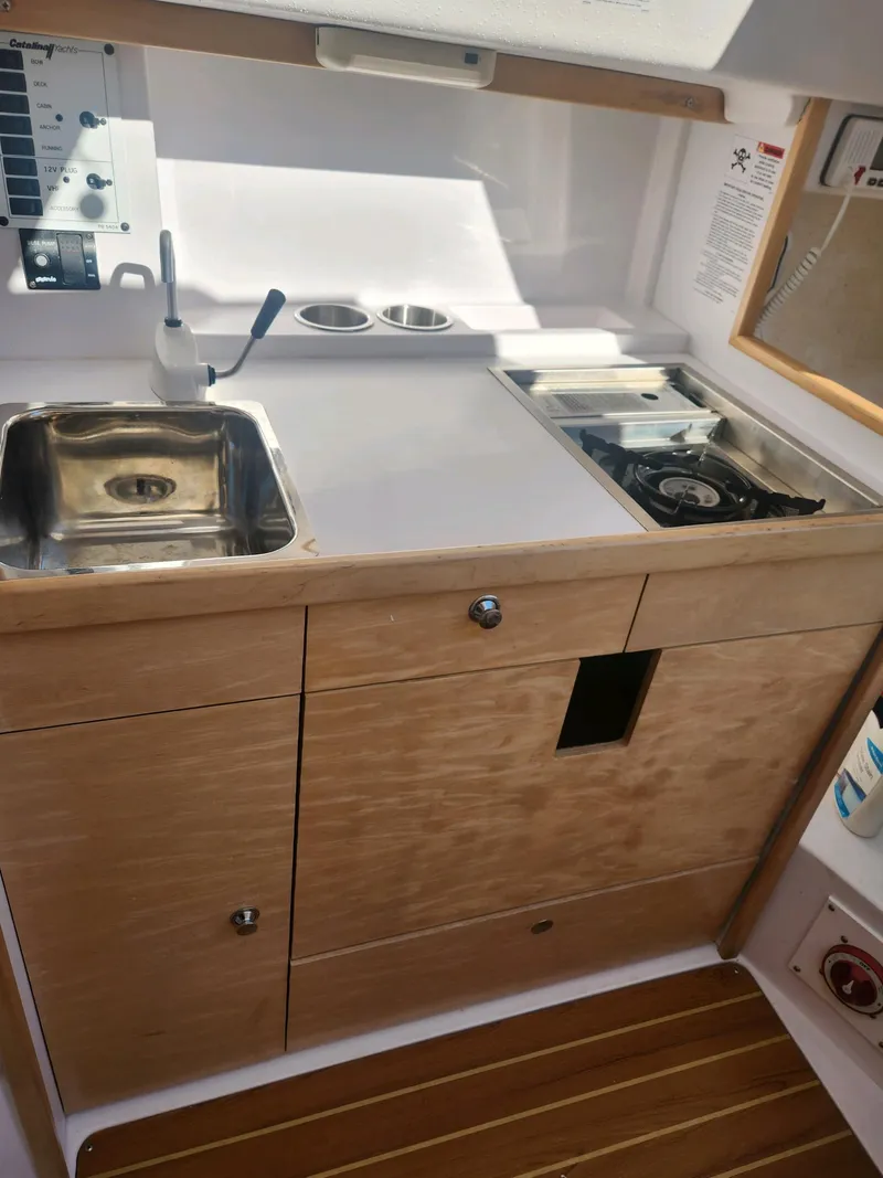 Slide: The Image of Interior view of a 2015 Catalina 275 Sport with sink and stove. - 25