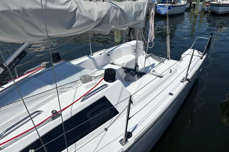 Slide: The Image of 2015 Catalina 275 Sport sailboat docked at marina, featuring sleek white design. - 3