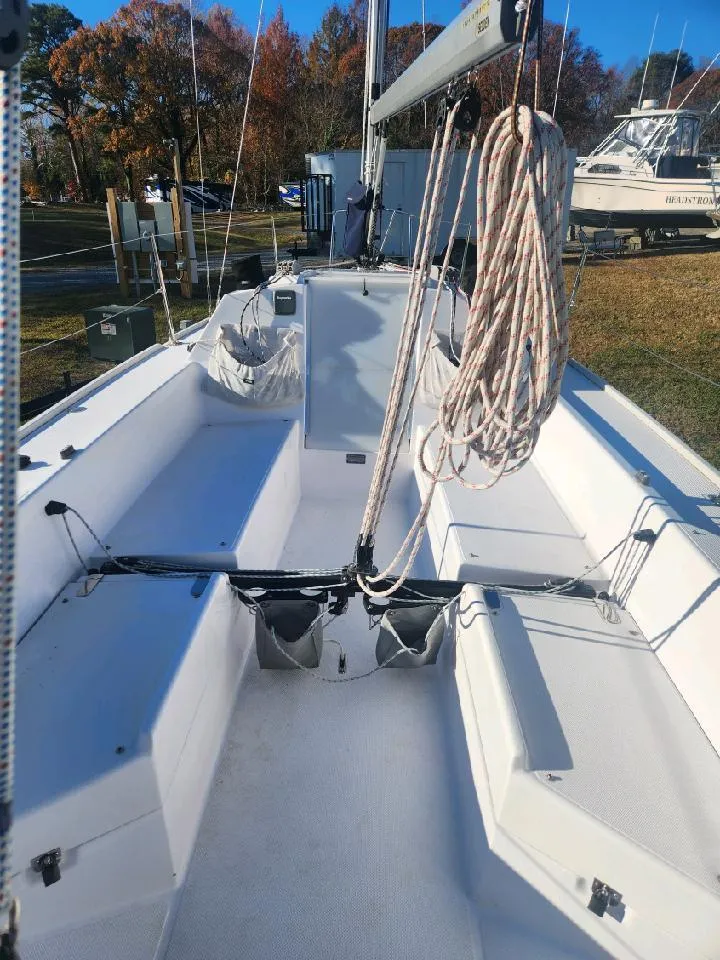 Slide: The Image of The image shows the cockpit of a 2015 Catalina 275 Sport with clear seating areas and rigging. - 14