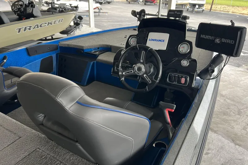 Slide: The Image of Interior of a 2018 Nitro Z18 boat with steering wheel and electronic displays. - 5