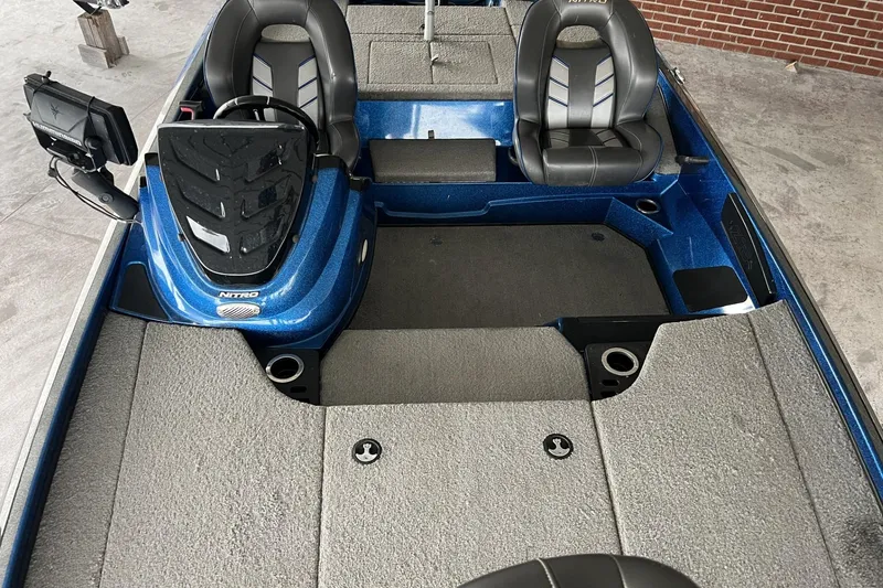 Slide: The Image of 2018 Nitro Z18 boat interior with dual seats and steering console. - 6