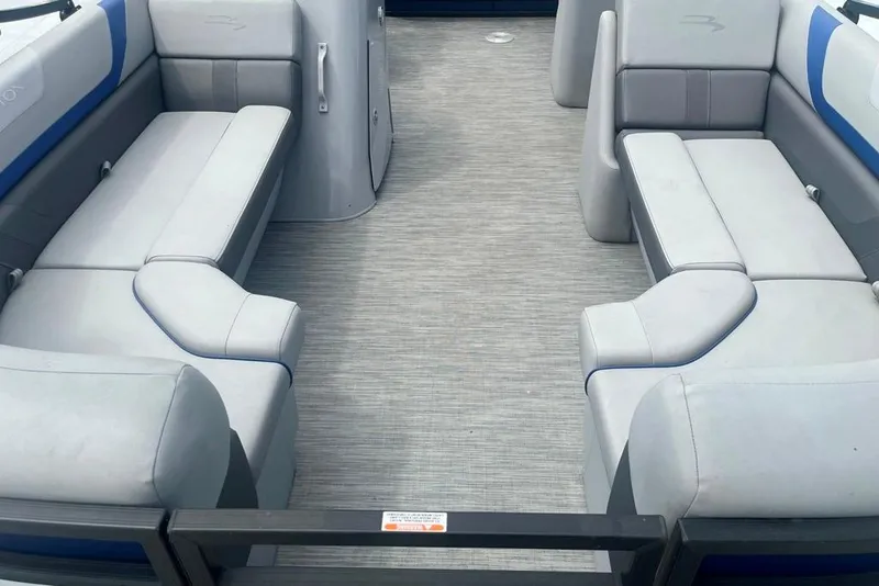 Slide: The Image of Interior of 2023 Bennington 23 SX pontoon boat with spacious seating and modern design. - 5