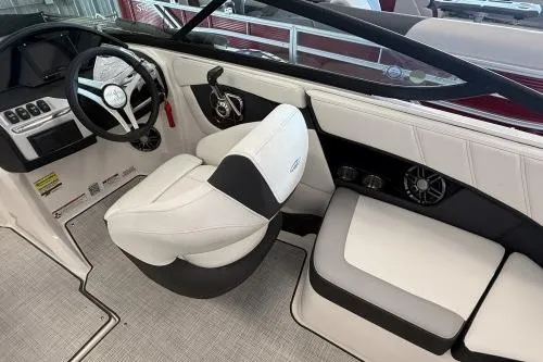 Slide: The Image of 2027 Regal 2000 ES boat interior with white seating and modern dashboard design. - 5
