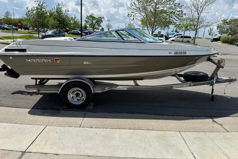 The Image of 1995 Mariah 180 Shabah boat on trailer, parked outdoors on a sunny day. - 1