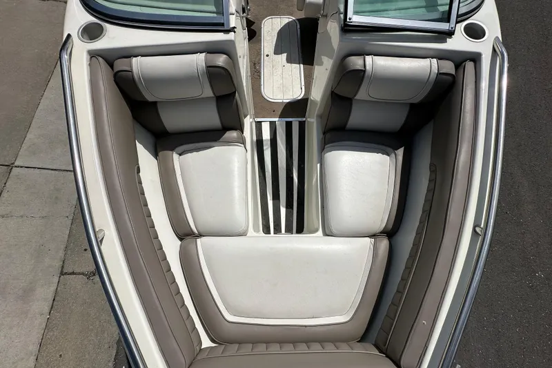 Slide: The Image of Interior view of a 1995 Mariah 180 Shabah boat, featuring cushioned seating and sleek design. - 5