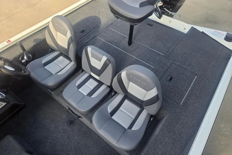 Slide: The Image of 2027 Lowe Stinger 175C boat interior with gray seating and carpeted deck. - 9