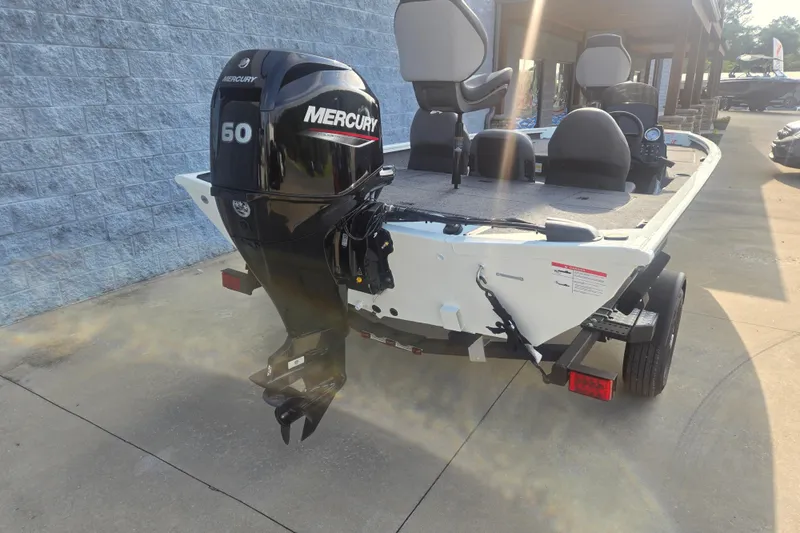 Slide: The Image of 2027 Lowe Stinger 175C boat with Mercury 50 outboard motor, parked on a trailer. - 3